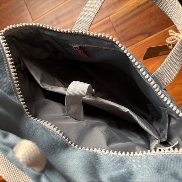 Modern Blue Backpack with Durable Fabric and Minimalist Design - Picture 4 of 6